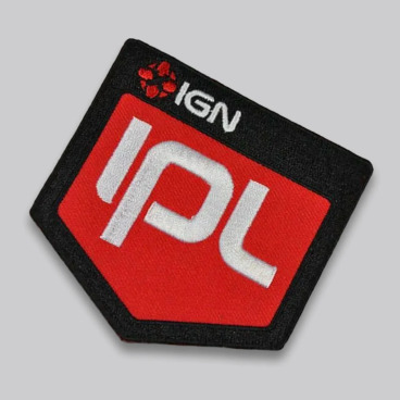 Red and black patch with the letters 'IPL' and a logo on a gray background.