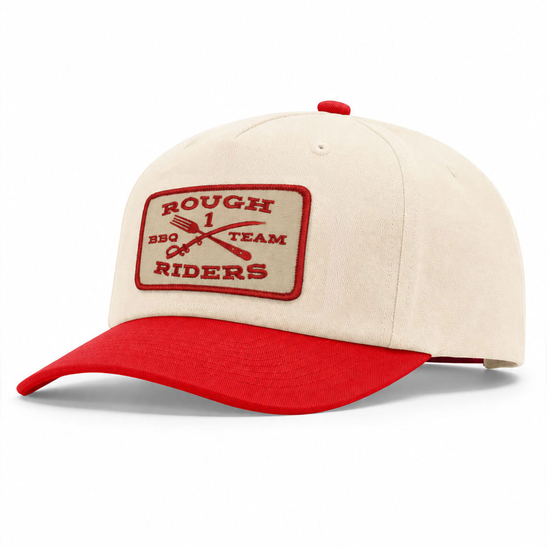 Cream and red Richardson 356 five-panel relaxed cap with a rectangular embroidered Rough Riders BBQ Team patch on the front.